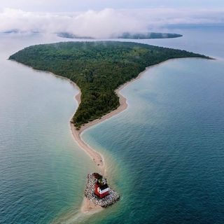 Perfect pic of Mackinac Island.
.
📸 michiganskymedia 
.
#mackinacisland #mackinacislandlife #roundisland #roundislandlighthouse #lighthouses #michiganlighthouses #michigan #nomi #northernmichigan #straitsofmackinac #lakehuron #greatlakes #greatlakesstate #dronephotography #drones #michiganscenery #michiganview #mittenstatelove #mittenlove #smittenwiththemitten